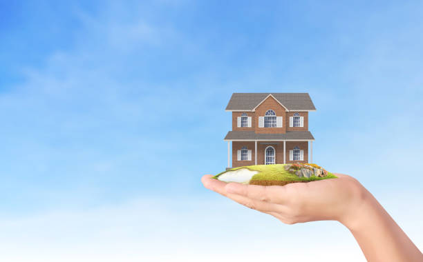 istock Mortgage concept by house from  hand 842107200