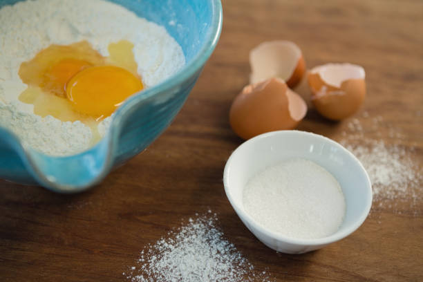 istock High angle view of egg and flour 842107228