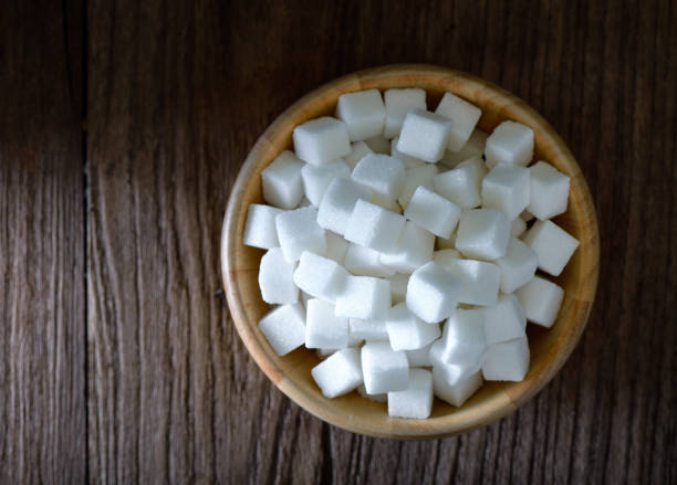 istock Sugar cubes in wood bowl on wood table 842107490