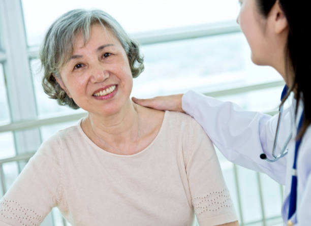 istock Female doctor with senior patient 842108038