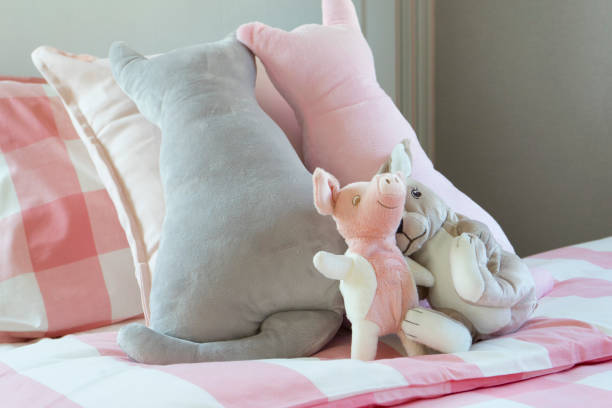 istock cute doll on girl bed 842111112