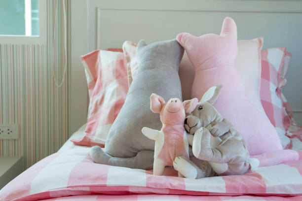 istock cute doll on girl bed 842111116