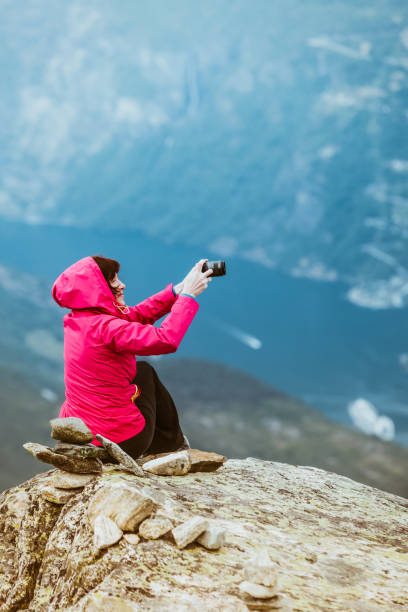 istock Tourist taking photo from Dalsnibba viewpoint Norway 842111676