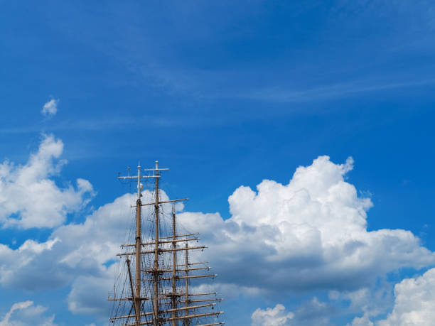 Mast of a sailboat and cloud in summer