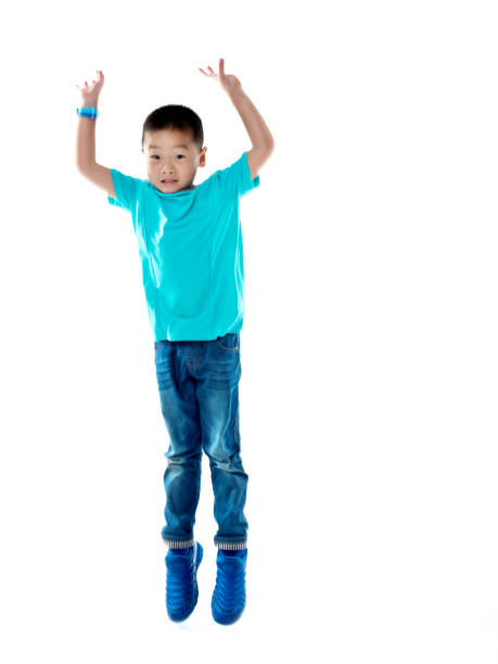istock Young asian boy jumping against white background 842111820