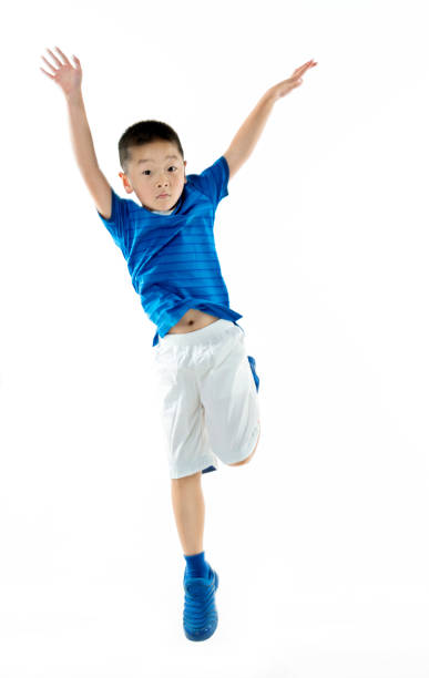 istock Young asian boy jumping against white background 842111868