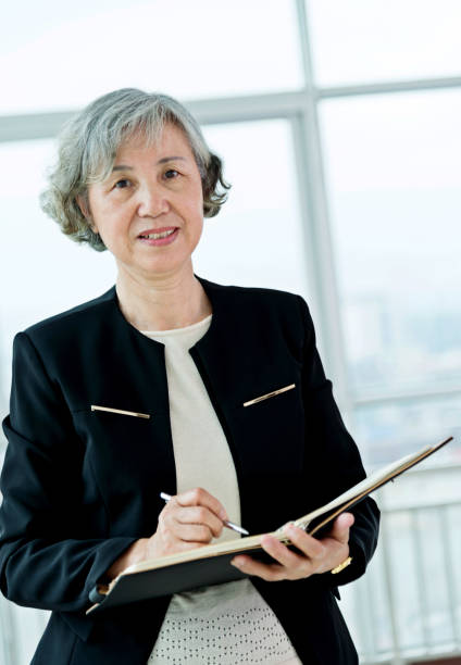 istock Senior businesswoman working in modern office 842112394