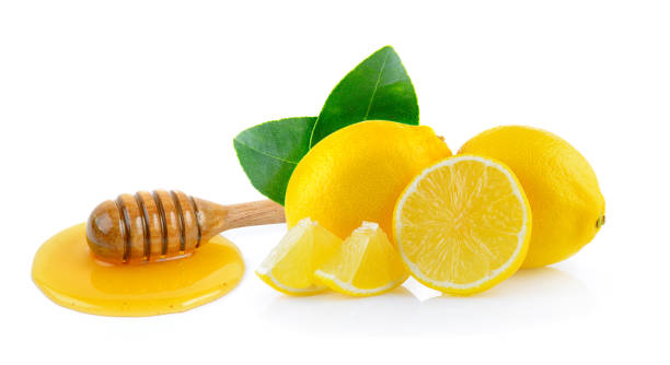 istock lemon and wooden honey dipper isolated on white background 842114362