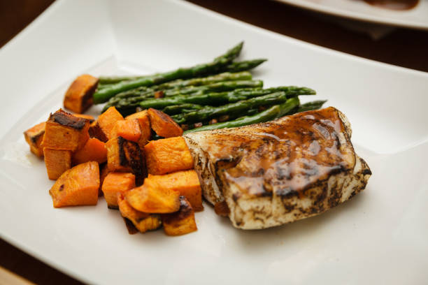 Seared sous vide cod filet with asparagus and sweet potatoes