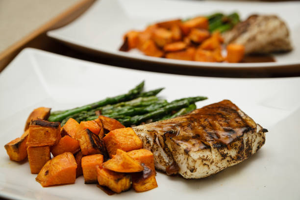 istock Seared sous vide cod filet with asparagus and sweet potatoes 842118792