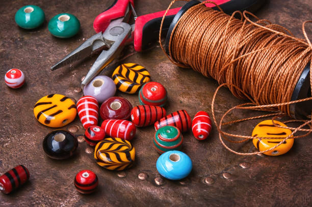 istock Colorful beads on wooden table 842119568