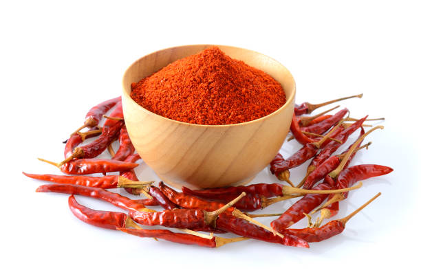 istock Cayenne pepper in wood bowl on white background 842119792