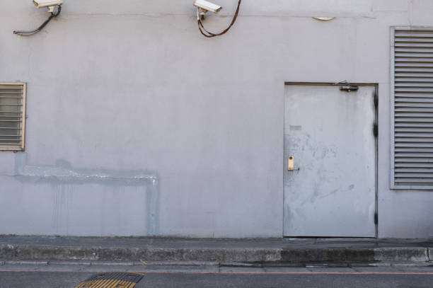 istock sidewalk by street wall & door 842122322