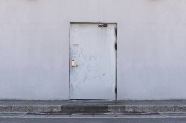 istock sidewalk by street wall & door 842122972