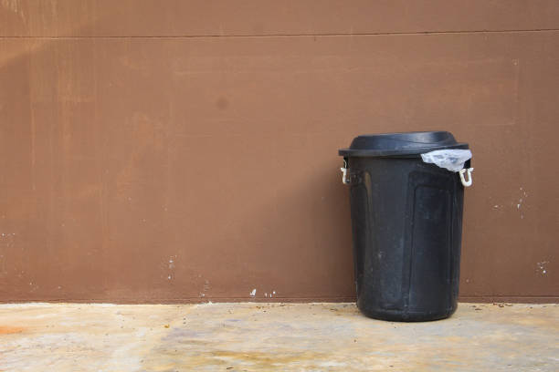 black bin and wall on the road