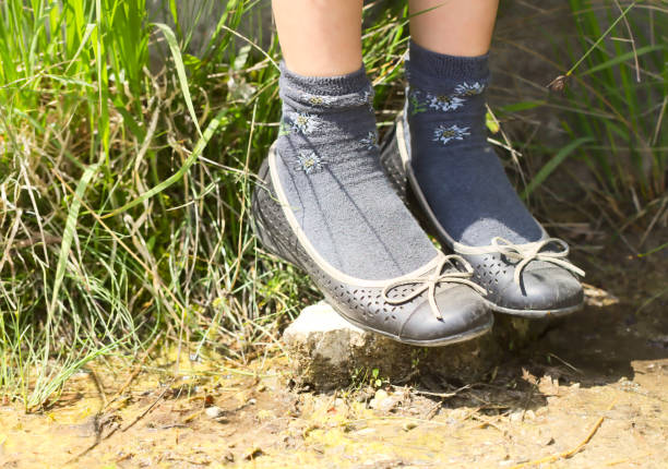 istock Girl Standing on Stone instead on Puddle 842127242