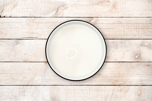 istock Milk bowl on wood background from directly above. Clipping path. 842129692