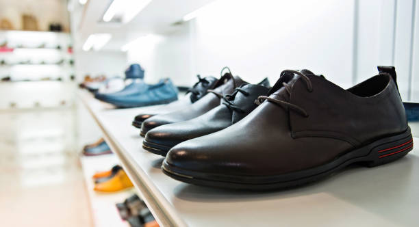 istock Men's shoes on sale displayed in a store 842129764