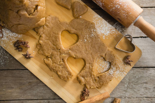 istock Pastry dough and pastry cutter on cutting board by rolling pin 842130172