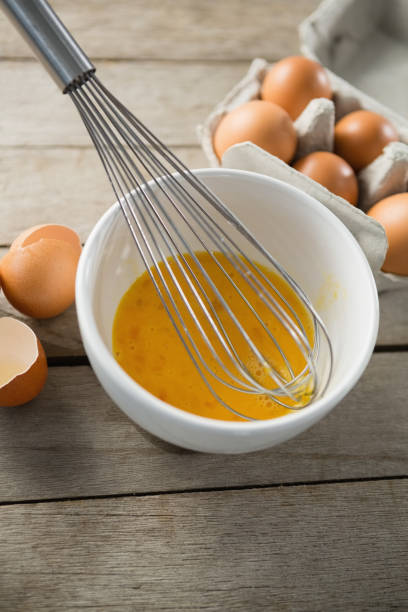 istock High angle view of eggs in bowl and carton 842130618