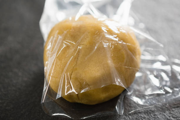istock Close up of dough in plastic wrap 842130632