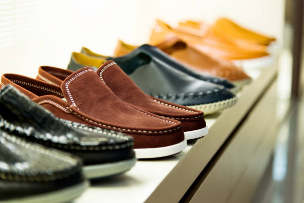 istock Men's shoes on sale displayed in a store 842130716