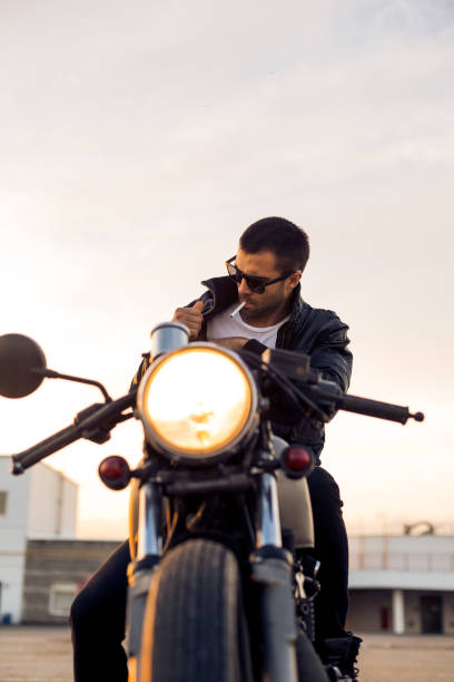 istock Brutal man sit on cafe racer custom motorbike. 842130836
