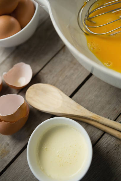 istock Close up of liquid and egg yolk in bowl 842131378