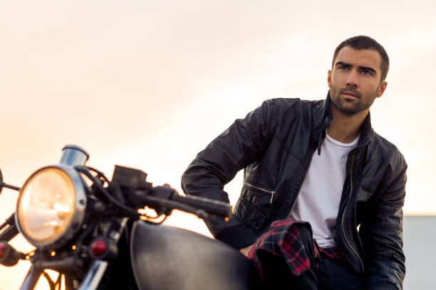 istock Brutal man sit on cafe racer custom motorbike. 842132980