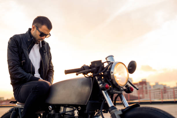 istock Brutal man sit on cafe racer custom motorbike. 842133016