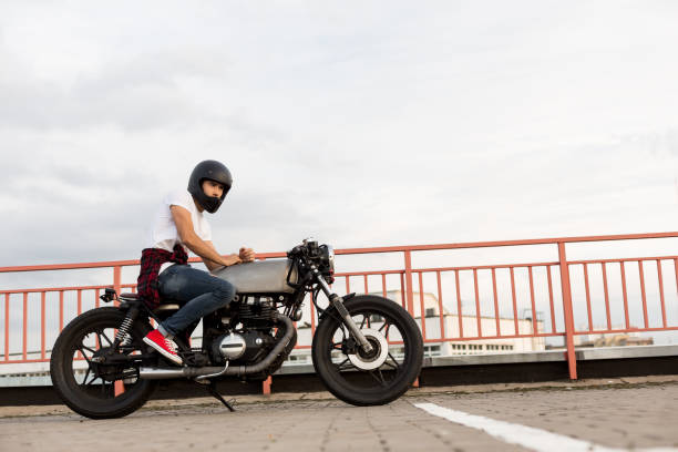 istock Brutal man sit on cafe racer custom motorbike. 842133284