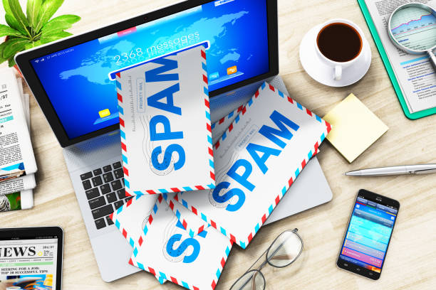 E-mail and spam concept Creative abstract e-mail, spam and junk mail internet web concept: 3D render illustration of the top view of heap of letters in envelopes falling from screen of modern metal office laptop or silver business notebook computer PC on the office table e mail spam stock pictures, royalty-free photos & images