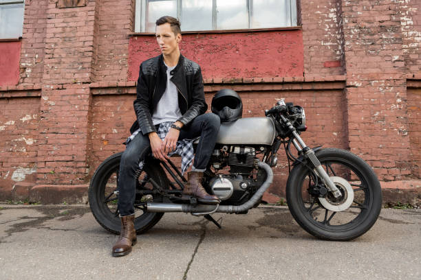 istock Brutal man sit on cafe racer custom motorbike. 842134050