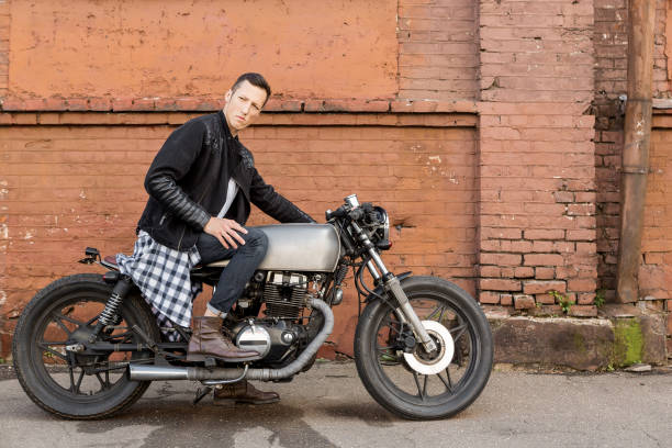 istock Brutal man sit on cafe racer custom motorbike. 842134146