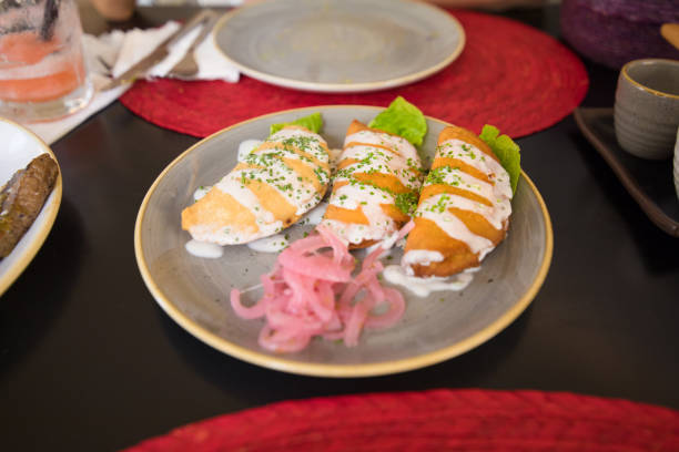 istock three quesadillas or patties in ceramic dish 842134598