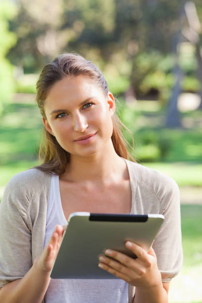 istock Woman with a tablet computer in the countryside 842141654