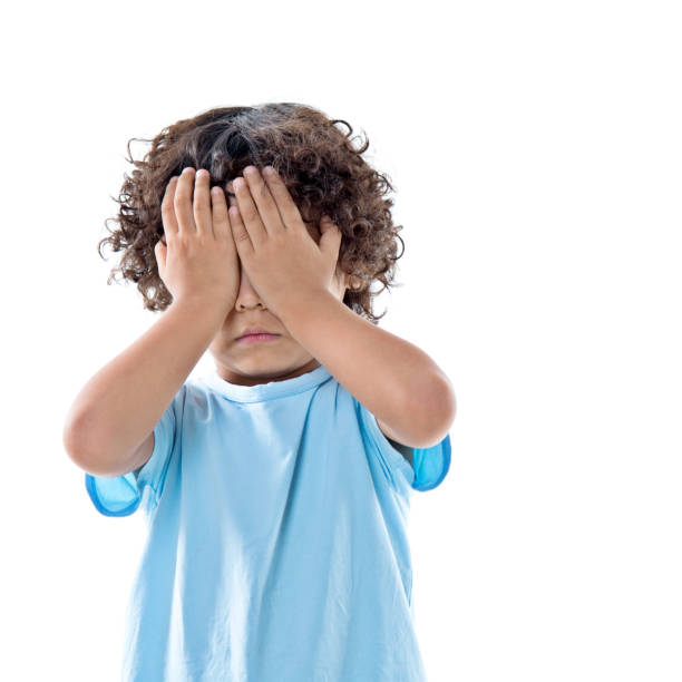 istock Little asian boy covering eyes against white background 842145518