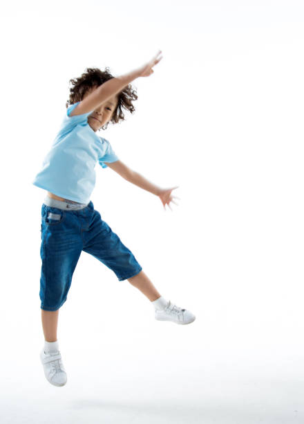 istock Little boy jumping isolated on white background 842147818