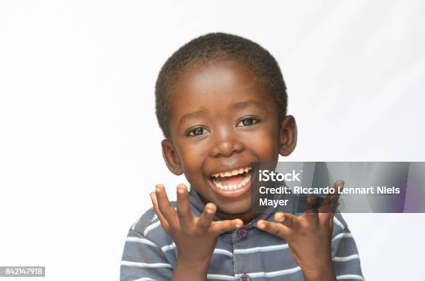 Surprised Little African Boy Excited About Getting A Present Isolated On White Stock Photo - Download Image Now