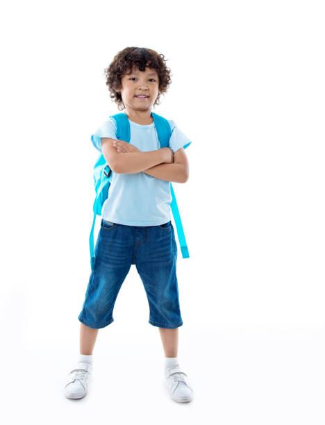 little asian boy with schoolbag against white background - little boys preschooler back to school backpack imagens e fotografias de stock