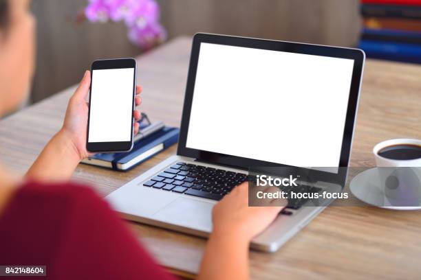 Using Laptop Computer And Smart Phone Stock Photo - Download Image Now - Laptop, Computer Monitor, Computer