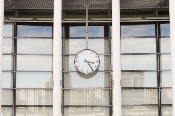 istock Clock in front of an office building 842149244