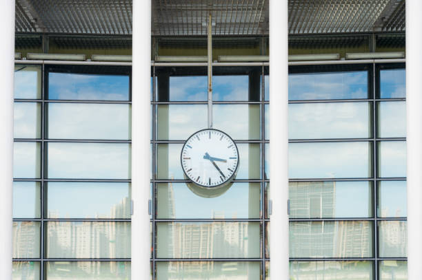 istock Clock in front of an office building 842152144