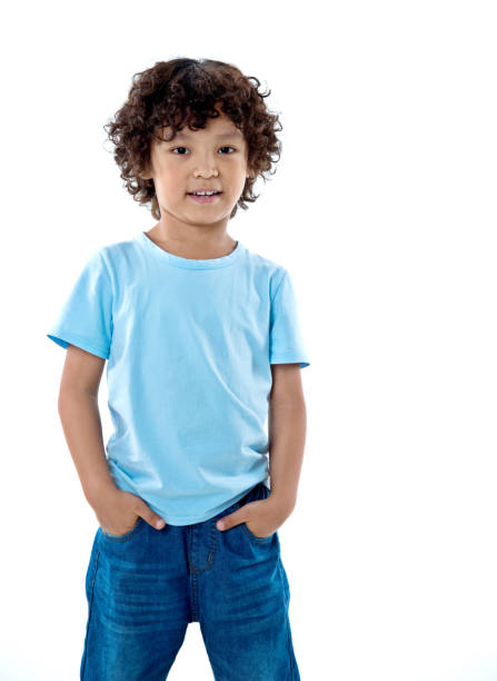 istock Smiling young boy standing against white background 842153100