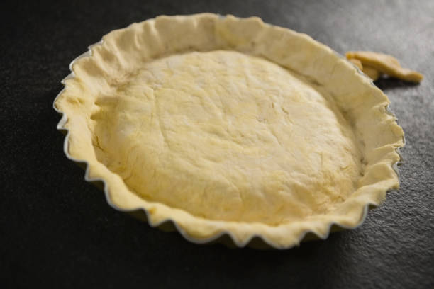 istock High angle view of pastry dough in backing pan 842153134