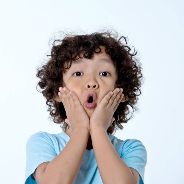 istock Boy surprised with hands on his mouth 842153318