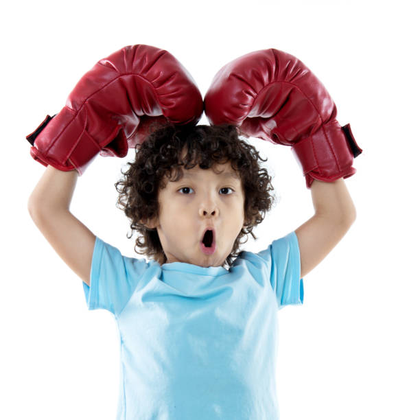 istock Little boy with red boxing gloves 842153396