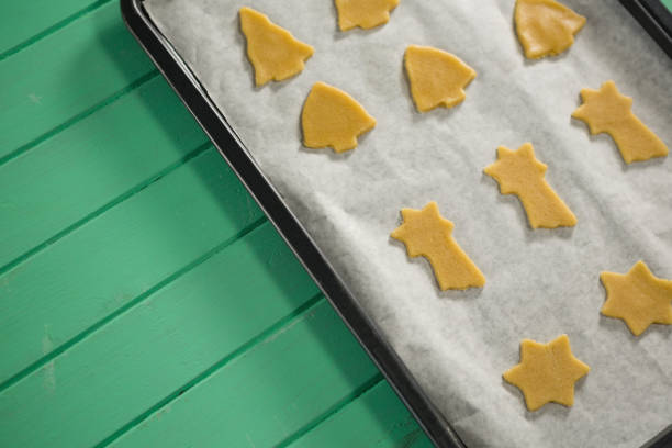 istock High angle view of various shape raw cookies in baking sheet 842153428