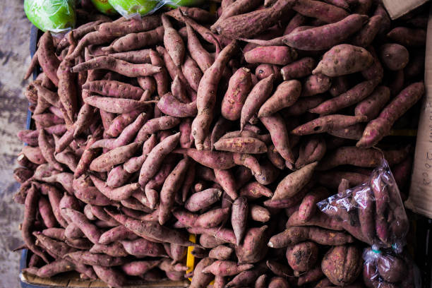 istock Sweet potatoes top view at market. 842153522