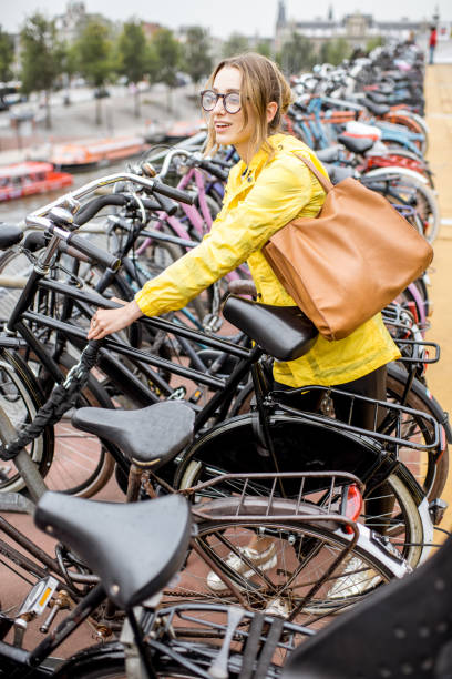 istock Woman parking a bicycle in Amsterdam 842156330